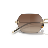 Oliver Peoples TK-13 avec une monture Or et des verres Brun - Variant
