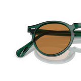 Oliver Peoples Gregory Peck Sun Limited Edition avec une monture Turquoise foncé translucide et des verres Brun - Variant